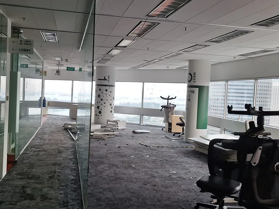 Wide view of a stripped-out office floor near handover