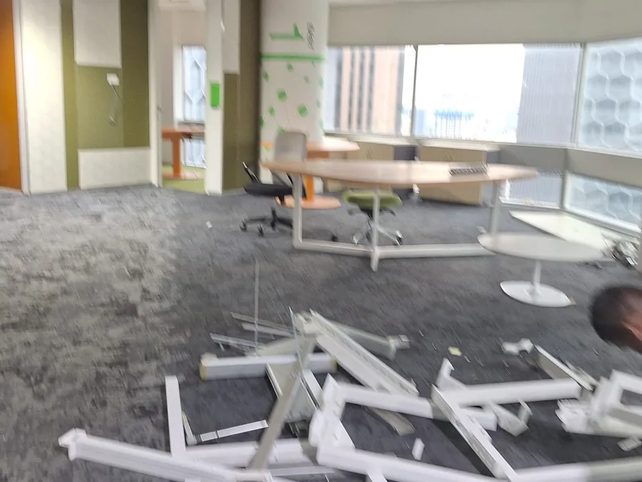 Trends Interior crew dismantling office furniture and partitions