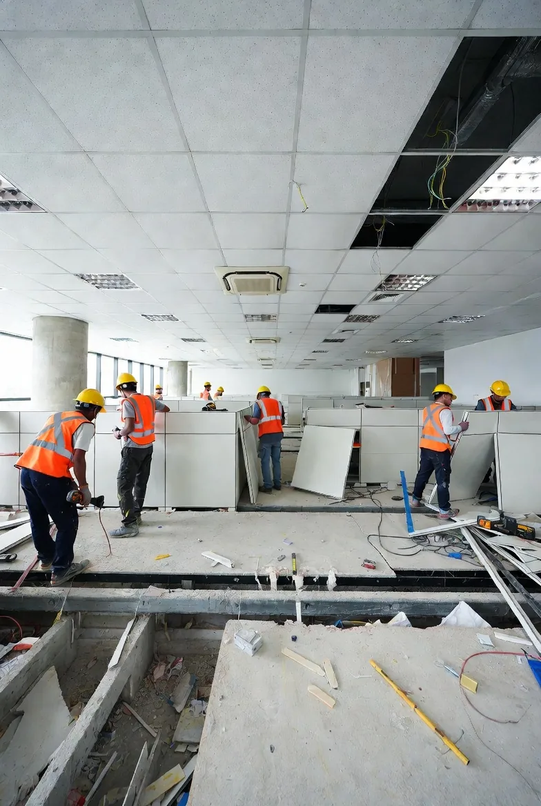 Trends Interior crew dismantling office partitions during a reinstatement